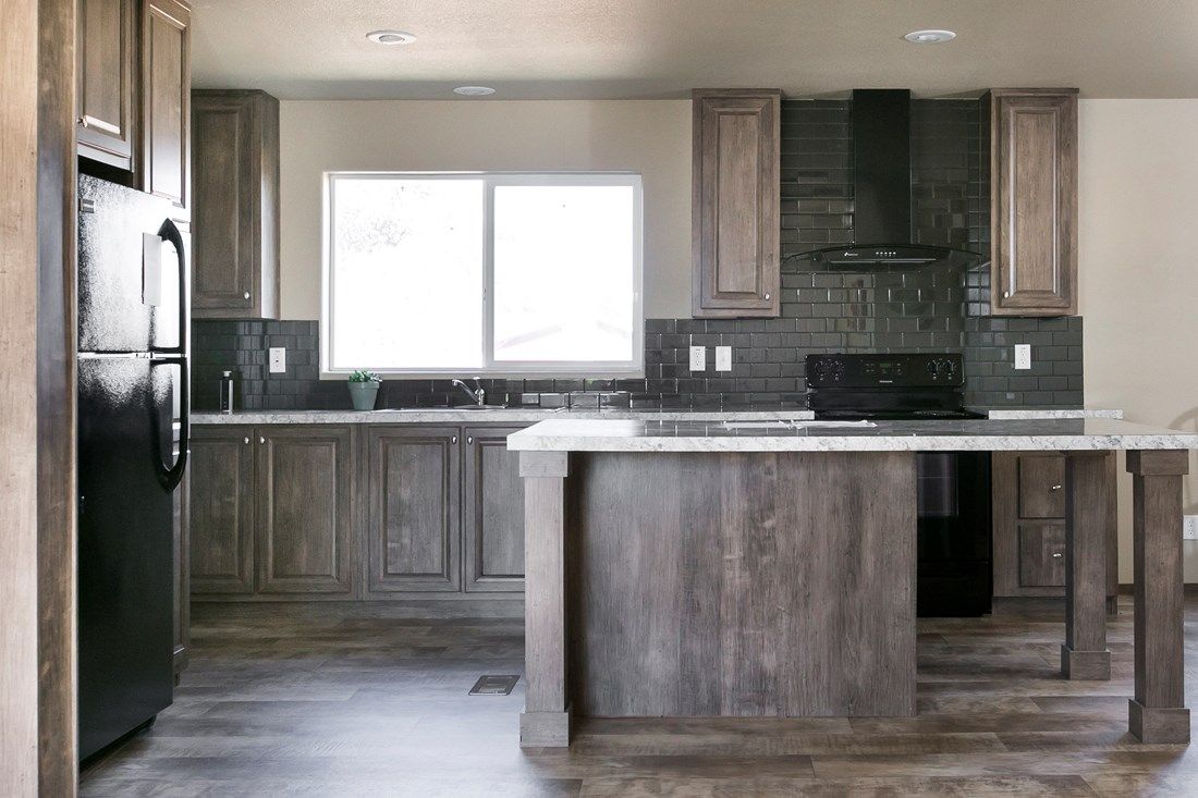 The 2022 COLUMBIA RIVER Kitchen. This Manufactured Mobile Home features 3 bedrooms and 2 baths.