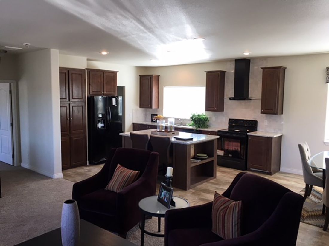 The 2024 COLUMBIA RIVER Kitchen. This Manufactured Mobile Home features 3 bedrooms and 2 baths.