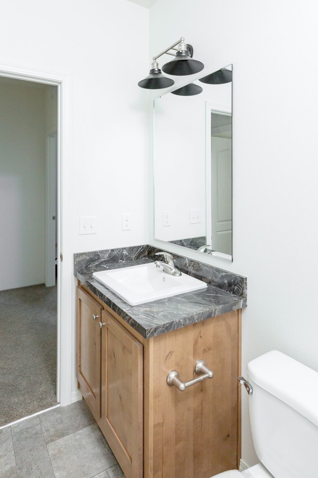 The 2025 COLUMBIA RIVER Guest Bathroom. This Manufactured Mobile Home features 4 bedrooms and 2 baths.