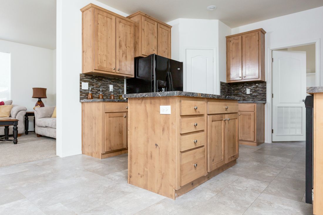The 2025 COLUMBIA RIVER Kitchen. This Manufactured Mobile Home features 4 bedrooms and 2 baths.