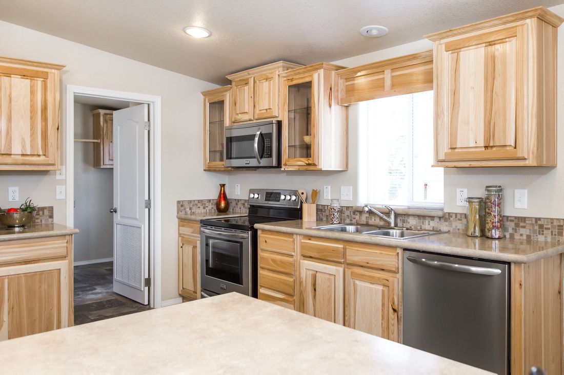 The 9590S BLACKMORE Kitchen. This Manufactured Mobile Home features 3 bedrooms and 2 baths.