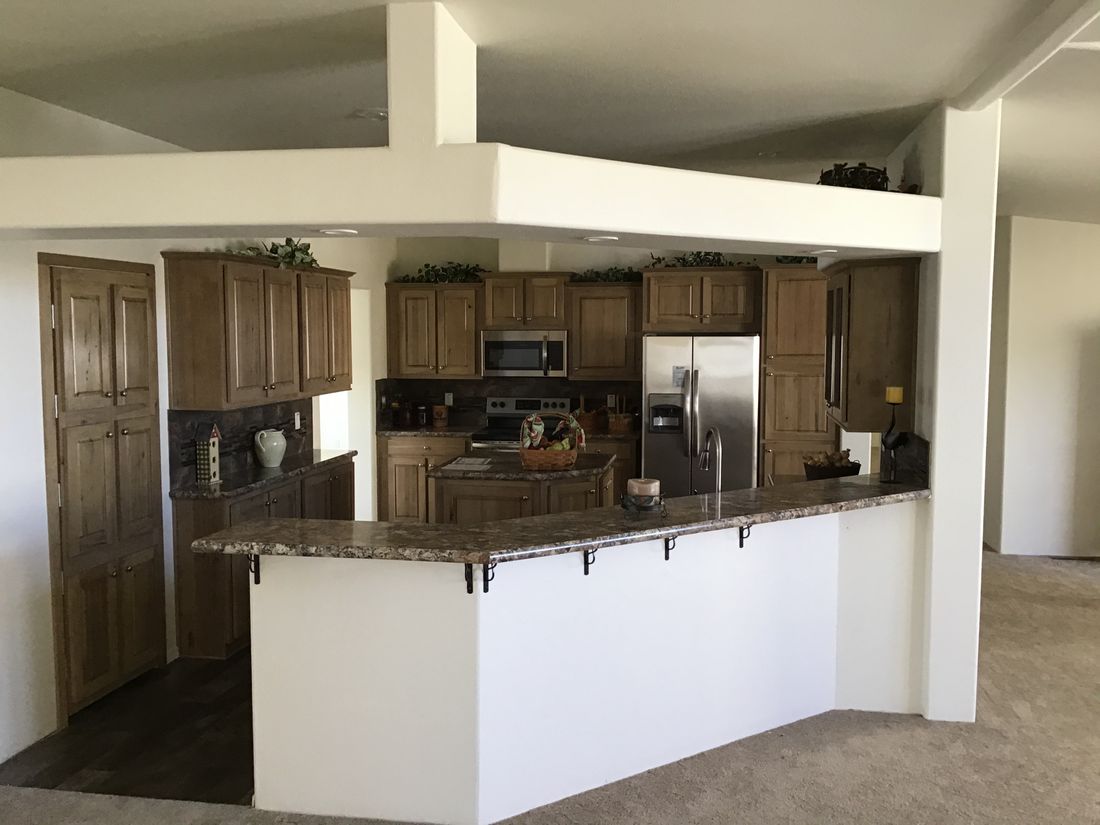 The 9593S         WASHINGTON Kitchen. This Manufactured Mobile Home features 3 bedrooms and 3 baths.