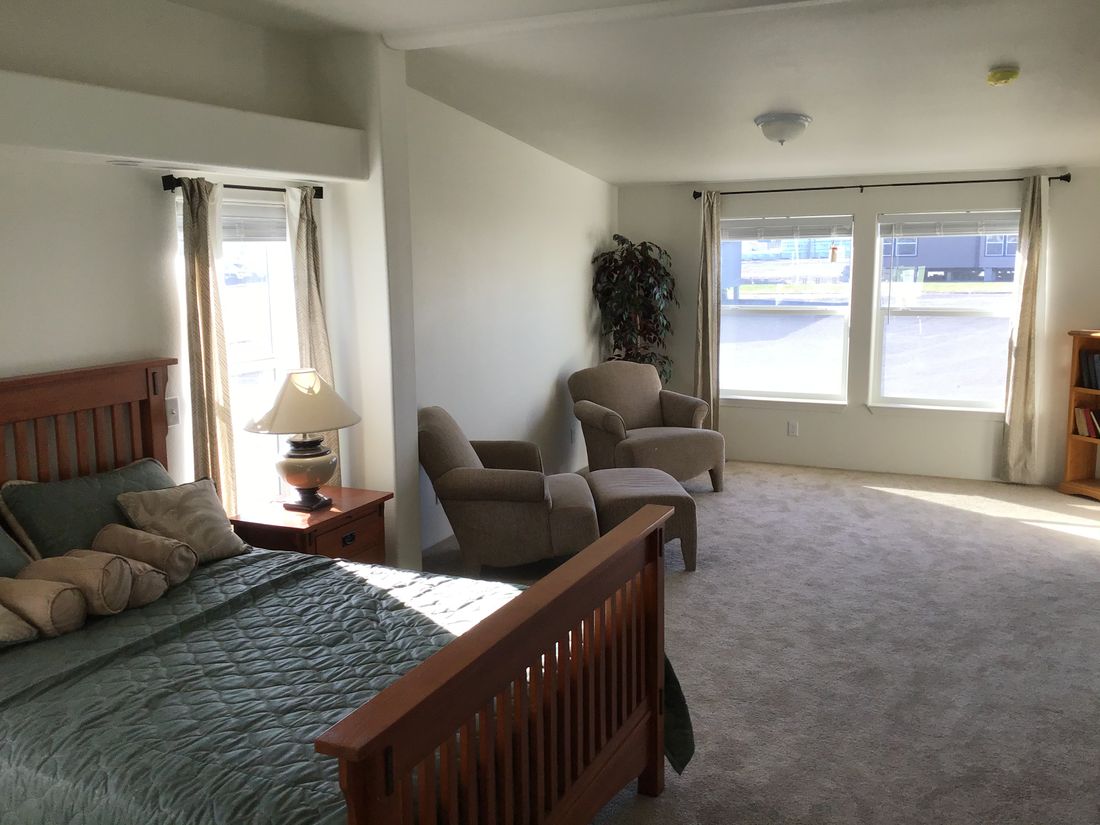 The 9593S         WASHINGTON Master Bedroom. This Manufactured Mobile Home features 3 bedrooms and 3 baths.
