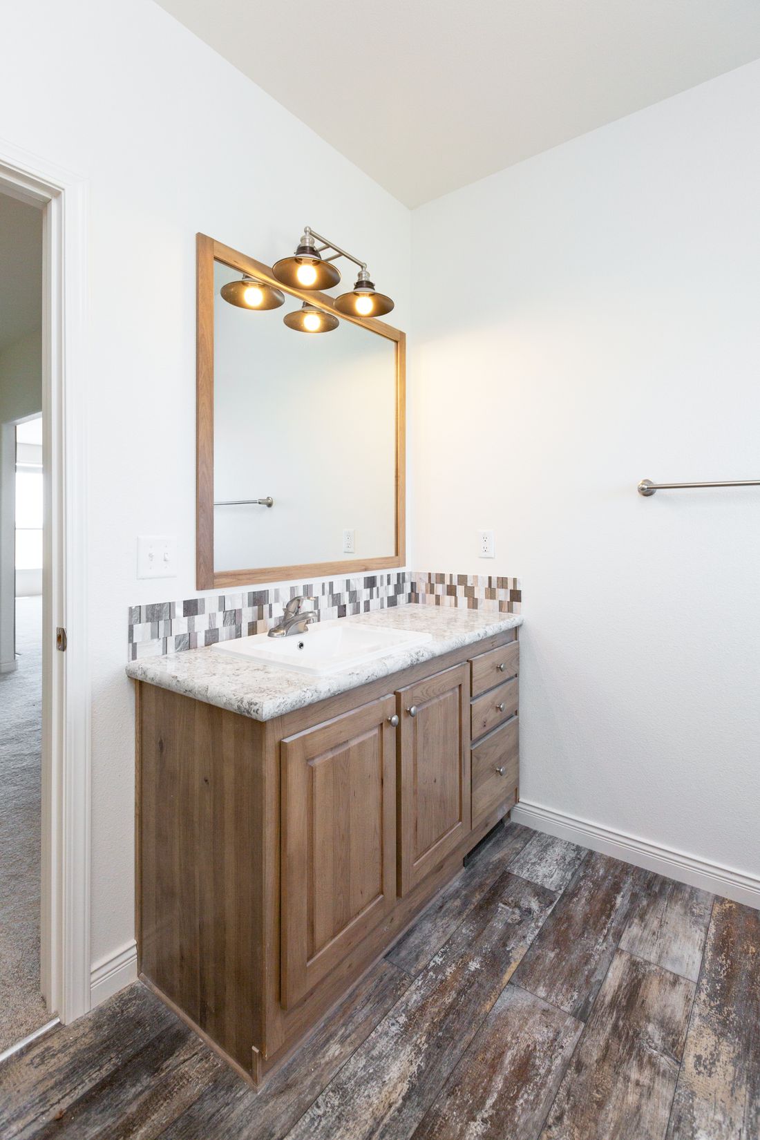 The 9585S MCKINLEY Guest Bathroom. This Manufactured Mobile Home features 3 bedrooms and 2 baths.