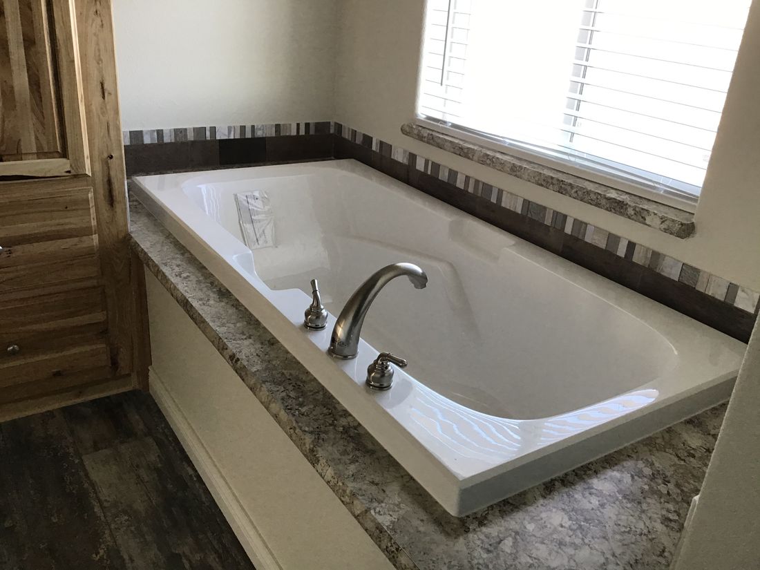 The 9596S RAINIER Master Bathroom. This Manufactured Mobile Home features 3 bedrooms and 2 baths.