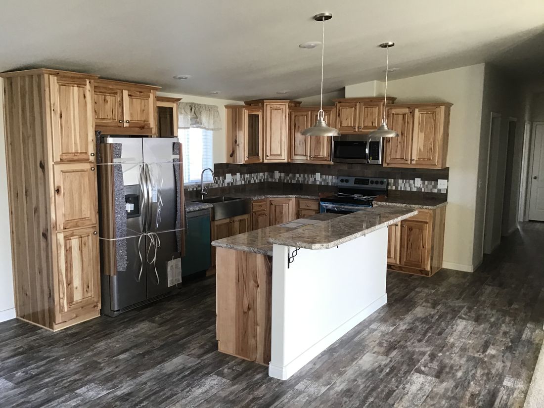 The 9596S RAINIER Kitchen. This Manufactured Mobile Home features 3 bedrooms and 2 baths.