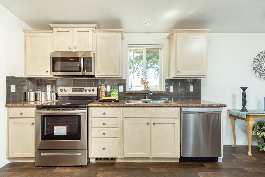 The 2848C CANYON Kitchen. This Manufactured Mobile Home features 3 bedrooms and 2 baths.
